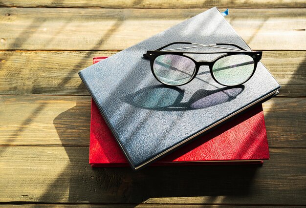 Photo eye glasses are placed on books