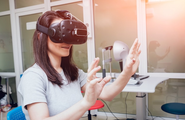 Eye treatment. Patient in virtual reality goggles. Checking the girl's vision with the help of virtual reality.