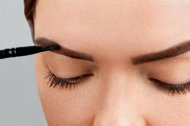 Eyebrow Correction Closeup Of Beautiful Young Woman With Perfect Makeup