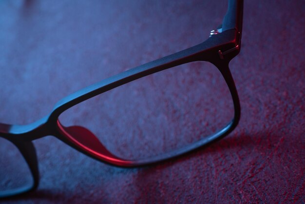 Eyeglasses in blue and red light