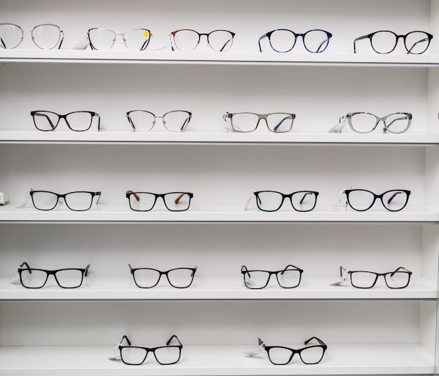 Eyeglasses stand in store Eye accessories in shopping stand