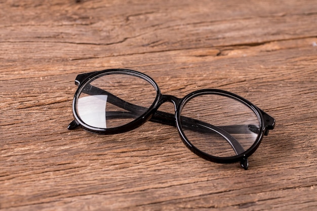 eyeglasses on wooden table