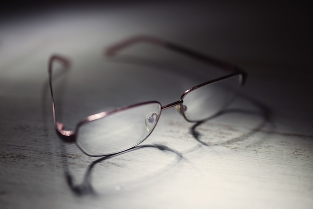 Eyeglasses on a wooden table