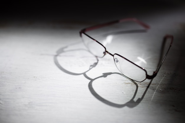 Eyeglasses on a wooden table