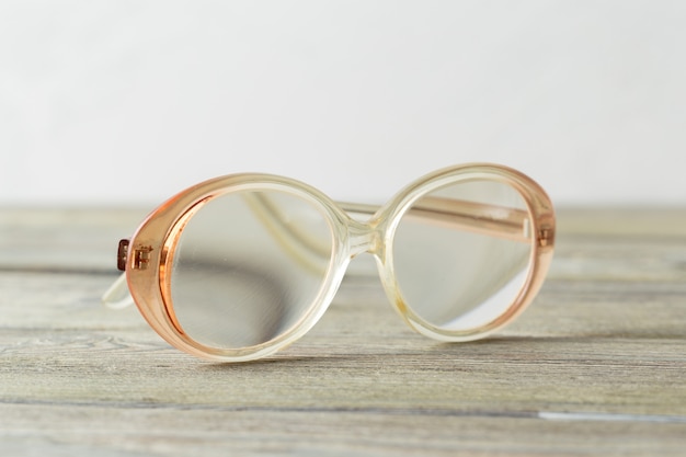 Eyeglasses on wooden table