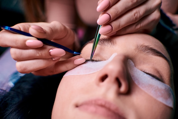 Eyelash extension procedure close up