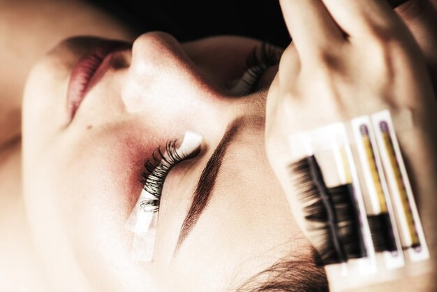 Eyelash Extension Procedure Woman Eye with Long Eyelashes Lashes close up