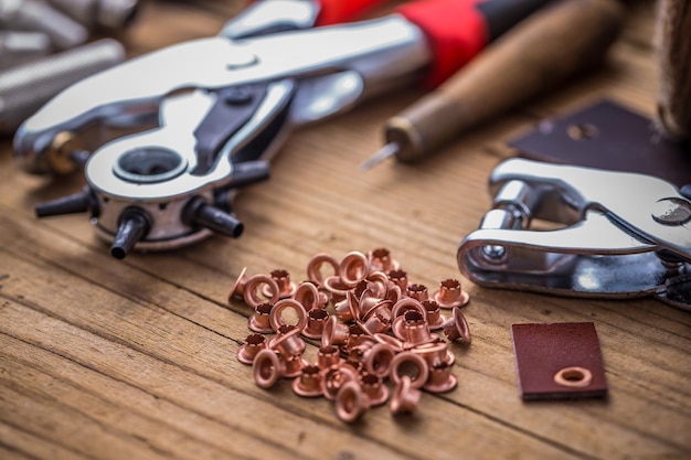 Eyelet punch and rivets