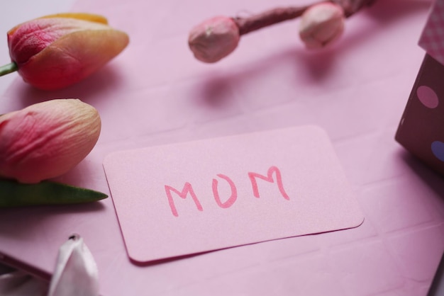 F mother day gift and flower on table