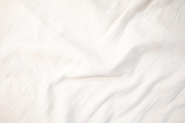 Fabric backdrop White linen canvas crumpled natural cotton fabric Natural handmade linen top view background Organic Eco textiles White Fabric texture