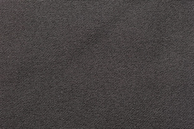 Fabric background with a black fabric cloth polyester texture.