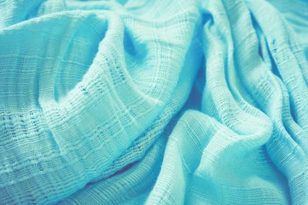 The fabric of the blue scarf