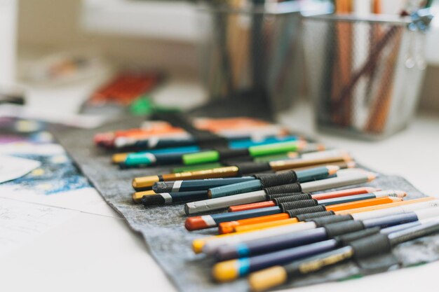 Fabric pencil case with the colored pencils close up artist tools selective focus background