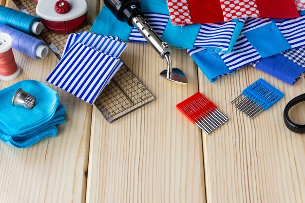 Fabric and sewing accessories on wooden