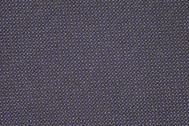 Fabric synthetic made of black and blue threads closeup uniform texture background