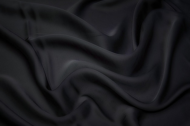 Fabric texture, background for design. Texture of black silk or cotton or wool fabric. Beautiful pattern of waven fabric.