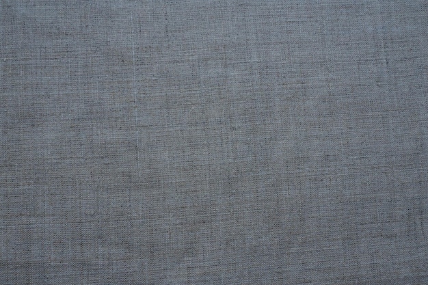 Fabric texture background Gray fabric with weave Natural slightly wrinkled look of the material Uniform copy space background Cotton canvas or woolen thin fabric laid evenly on the surface