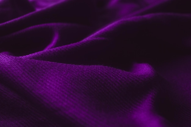 Fabric texture background of purple color (Very Peri). Close up of clothes as wallpaper.