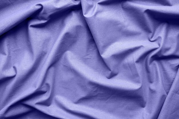 fabric texture background toned with Very Peri color wavy fabric