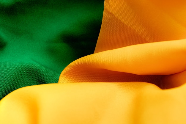 Photo fabric texture background with green and yellow colors reminding the colors of the brazilian flag