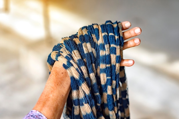 Photo fabric that has been dyed with indigo ready for weaving, sakon nakhon, thailand