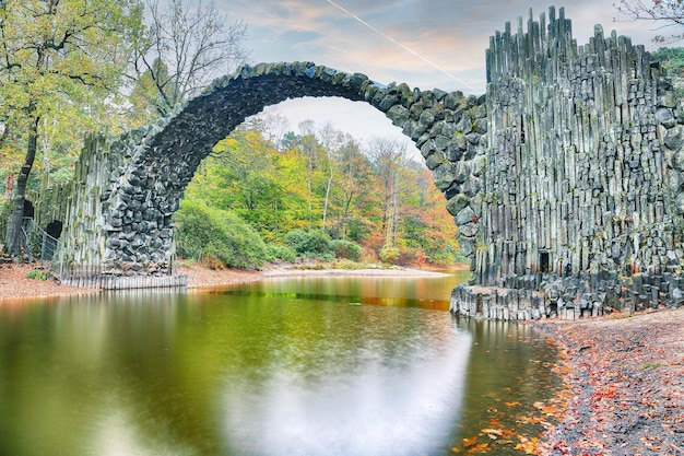 Fabulous autumn landscape in azalea and rhododendron park kromlau rakotz bridge rakotzbrucke devil's bridge location gablenz state of saxony germany europe