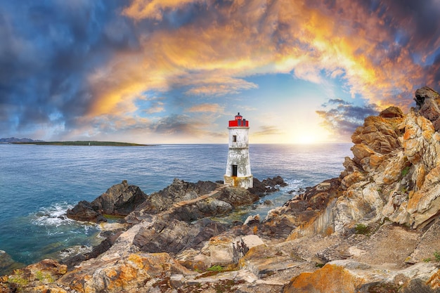 Fabulous view of sunrise over Capo Ferro Lighthouse