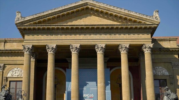 Facade of ancient building with columns and triangular portico action beautiful historical building