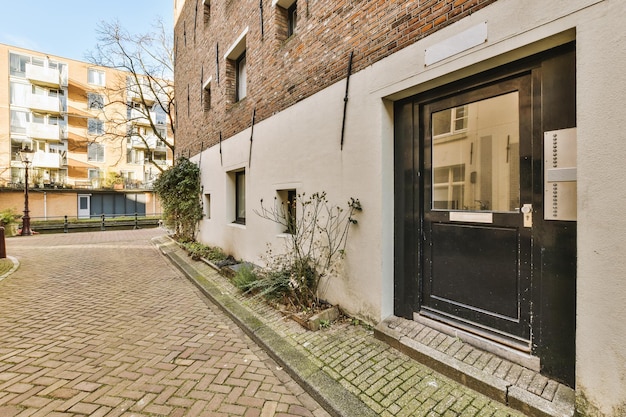 The facade of a brick building with wooden door