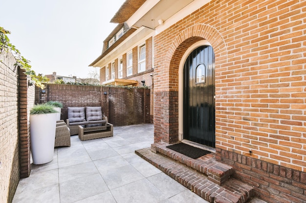 The facade of a brick building with wooden door