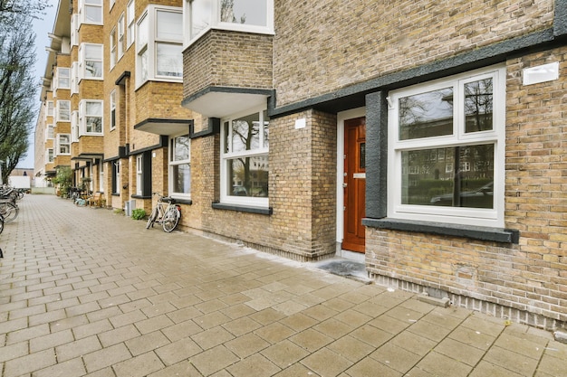 The facade of a brick building with wooden door