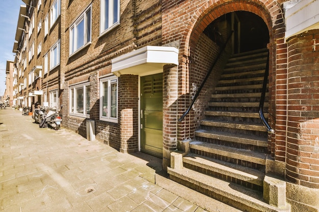 The facade of a brick building with wooden door