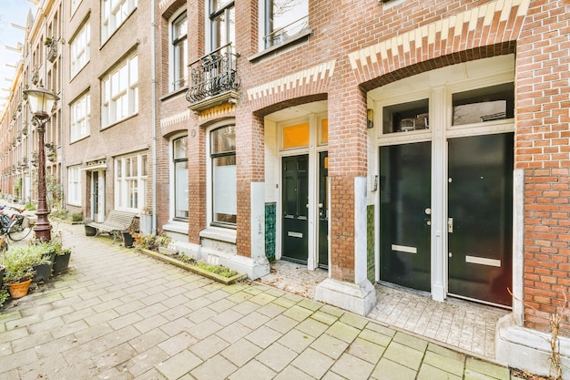 The facade of a brick building with wooden door