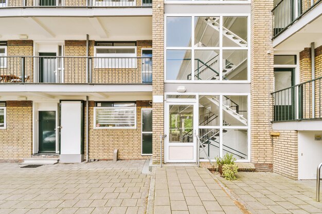 The facade of a brick building with wooden door