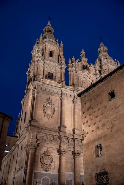 Facade of Casa de las Conchas in Salamanca at night Spain