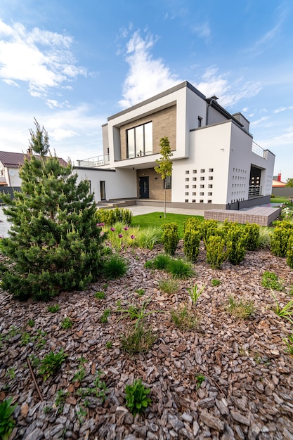 Facade of the house. New concrete building. Modern architecture.