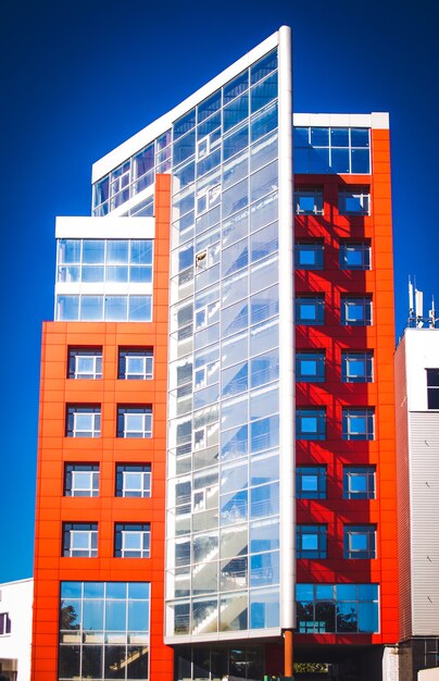 Facade of the house red in the high-tech style