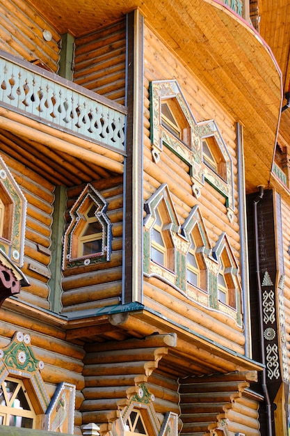 Facade house with balconies made of wooden frame Old Russian style