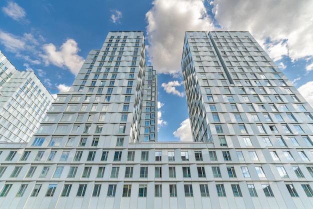 Facade of a modern skyscraper active construction industry Sale and rental of real estate