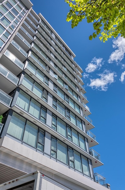 Facade of new residential building on blue sky background