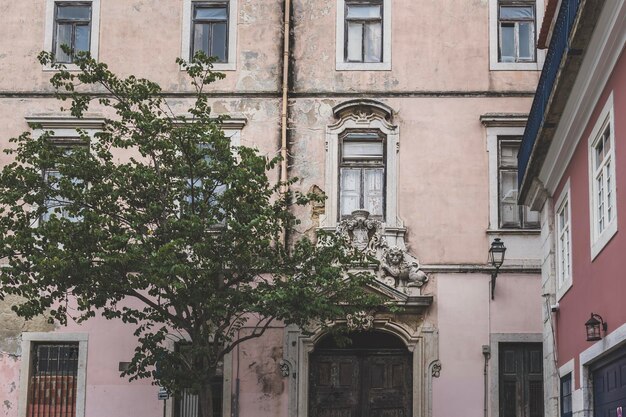 Facade of an old vintage apartment building in lisbon portugal