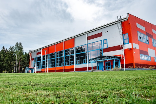 The facade of sports complex in summer.