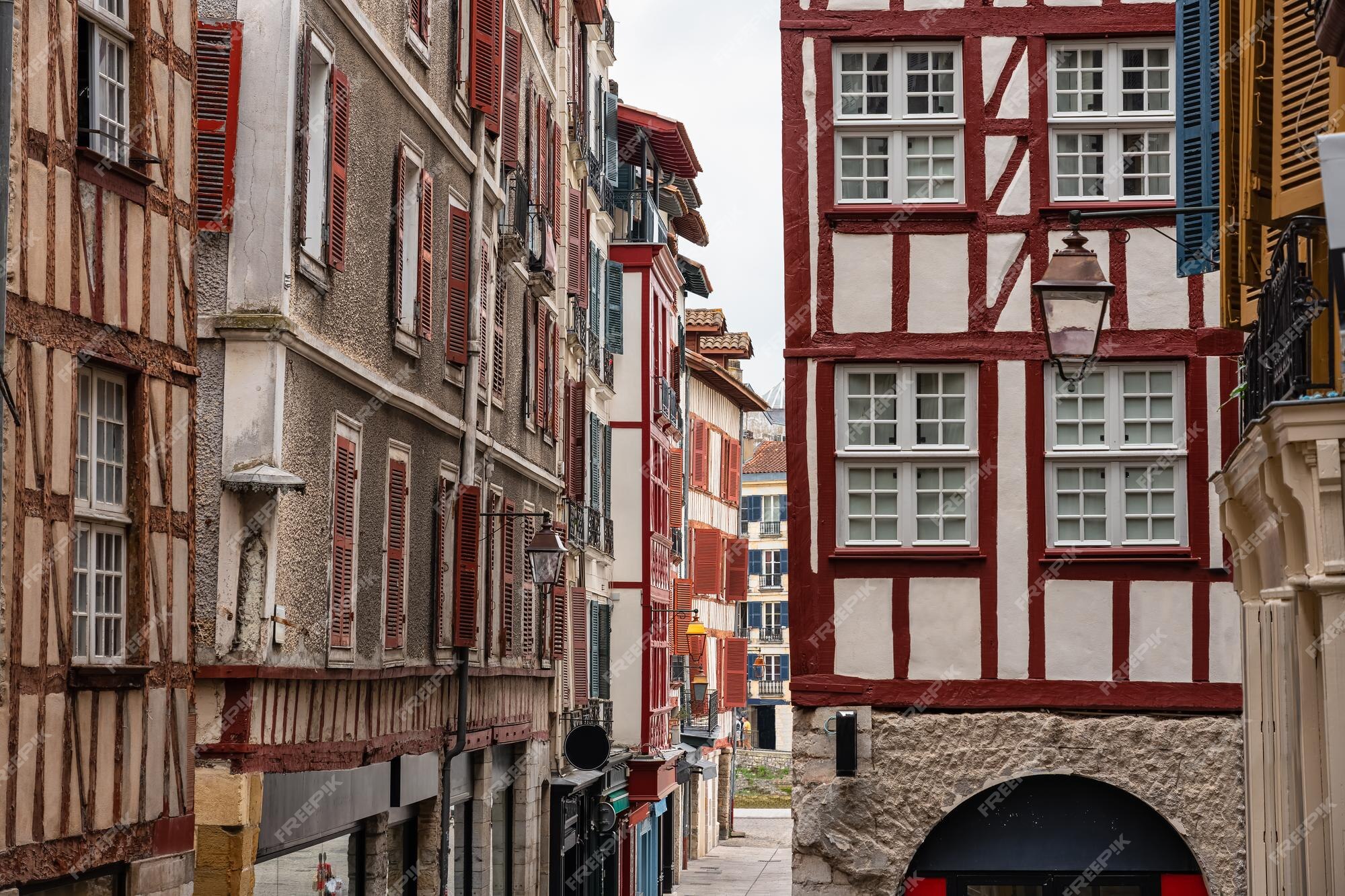 Premium Photo  Facade with doors and windows typical of the south of  france in the basque country bayonne