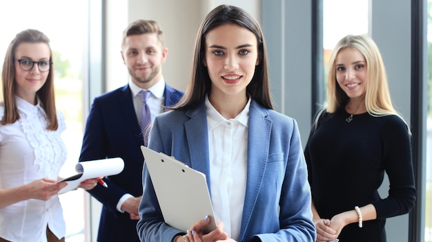 Face of beautiful woman on the background of business people