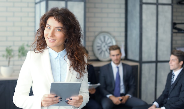 Face of beautiful woman on the background of business people.