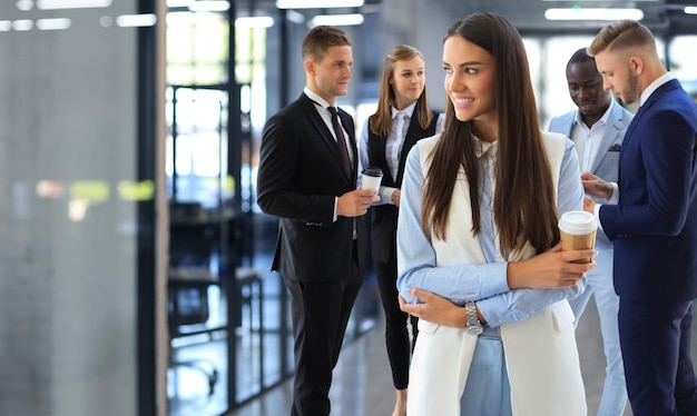 Face of beautiful woman on the background of business people