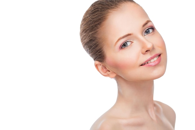 Face of a beautiful young woman on a white background