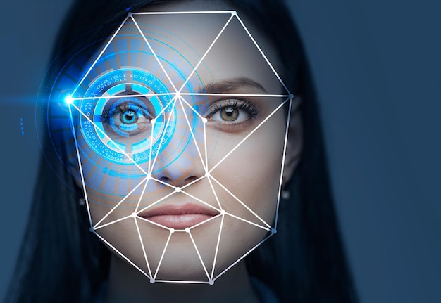 face of beautiful young woman with colorful hud interface near her eye and biometric verification technology. dark blue background. concept of face recognition and hi tech. toned image double exposure