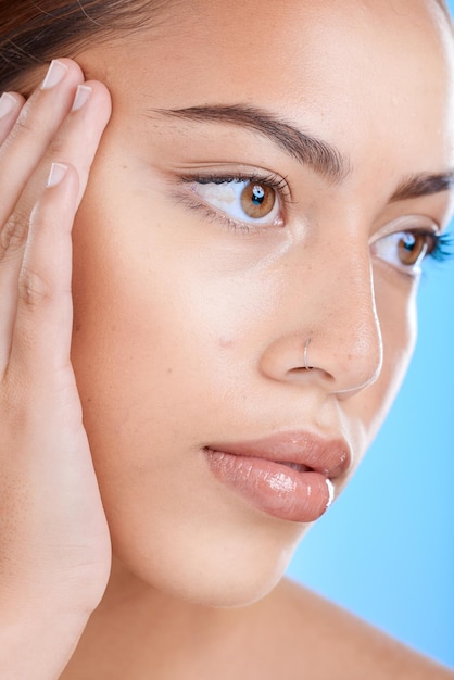 Face beauty and skincare with a model black woman in studio closeup on a blue background for wellness Botox microblading and cosmetics with an attractive young female inside for luxury treatment