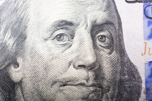 The face of Benjamin Franklin on the hundred dollar banknote